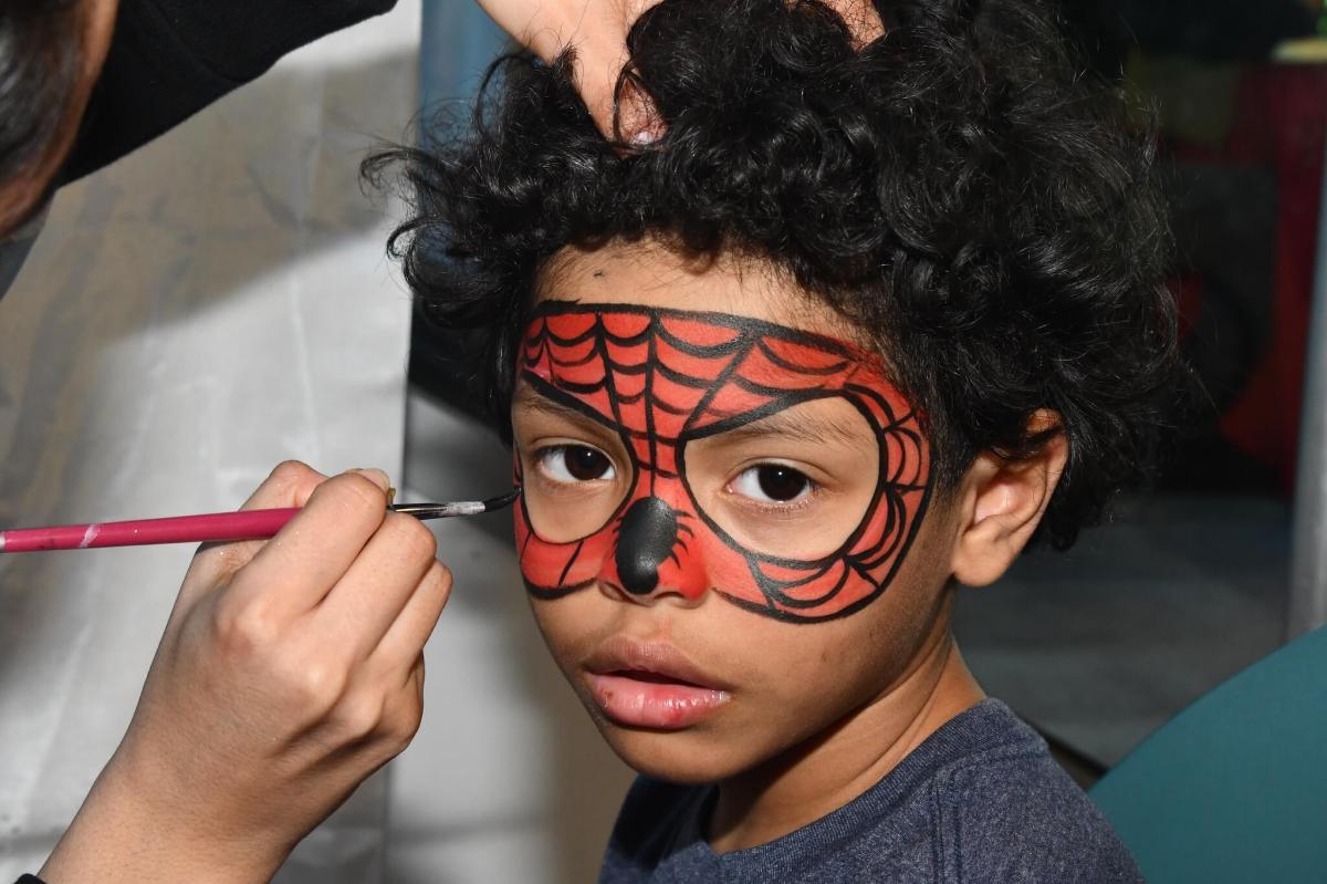 little boy getting his face painted