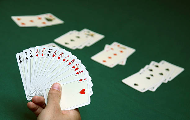 Hand holding cards ready to play bridge