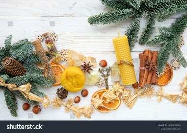 stock-photo-seasonal-magic-things-and-fir-branches-on-white-wooden-table-sun-and-moon-symbol-candle-crystals-2039030162_eb68be