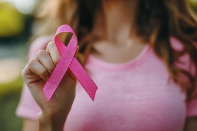 woman holding pink ribbon breast cancer awareness. concept healthcare.