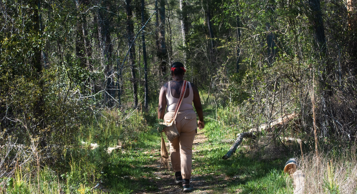 Chenae Walking through an old growth forest in GA. Photo by Gabriel Rudd [8]