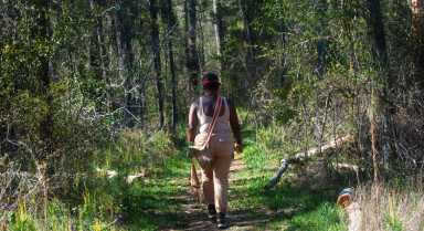 Chenae Walking through an old growth forest in GA. Photo by Gabriel Rudd [8]