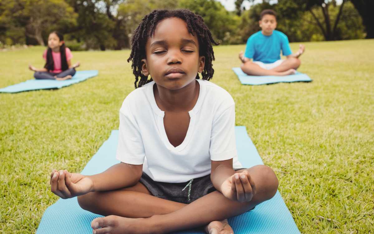 boy-meditation-yoga-park-cropped