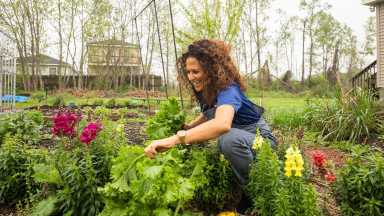 Feature-Image-2_jackie-sumell-working-in-the-Solitary-Gardens-on-Andry-Street-scaled