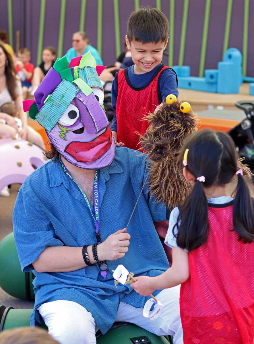 TJ with boy and puppet