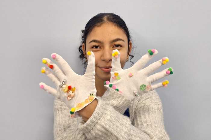 Receive a pair of white winter gloves an