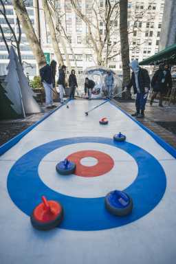 Kids at Curling Cafe in Bank of America Winter Village at Bryant Park.